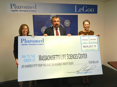 From left to right: Sanofi Biosurgery Senior Vice President and General Manager Alison Lawton and Pluromed President & CEO Jean-Marie Vogel present a check to Massachusetts Life Sciences Center President & CEO Susan Windham-Bannister representing Pluromed’s repayment of the Center’s 2009 Accelerator loan.