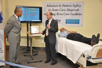 Governor Deval Patrick and EarlySense CEO Avner Halperin participate in demonstration of the EarlySense patient monitoring system