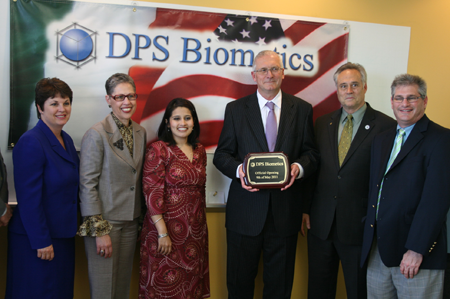 From Left to Right:  Bonnie Biocchi, President & CEO of the MetroWest Chamber of Commerce; Massachusetts Life Sciences Center President & CEO Susan Windham-Bannister; Puja Mehta, aide to State Senator Karen Spilka; Managing Director of DPS Engineering Frank Keogh; State Representative Christopher Walsh (D-Framingham); and State Representative David Linsky (D-Natick) gather to celebrate the grand opening of DPS Biometic’s new offices in Framingham.