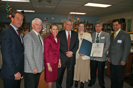 From Left to Right:  Matthew Morrissey, Executive Director, New Bedford Economic Development Council, Greater New Bedford Vocational Technical High School Superintendent Director Michael Shea, Massachusetts Life Sciences Center President & CEO Susan Windham-Bannister, New Bedford Mayor Scott Lang, Rosanne Franco, Science Department Head, GNB Voc-Tech; Allen Duarte, Grants Liaison, GNB Voc-Tech; and Five Star Manufacturing President David Cabral, receive a legislative citation from State Representative Stephen Canessa recognizing the school’s success in receiving an equipment & supply grant of $99,994 from the Massachusetts Life Sciences Center for life sciences training and education.