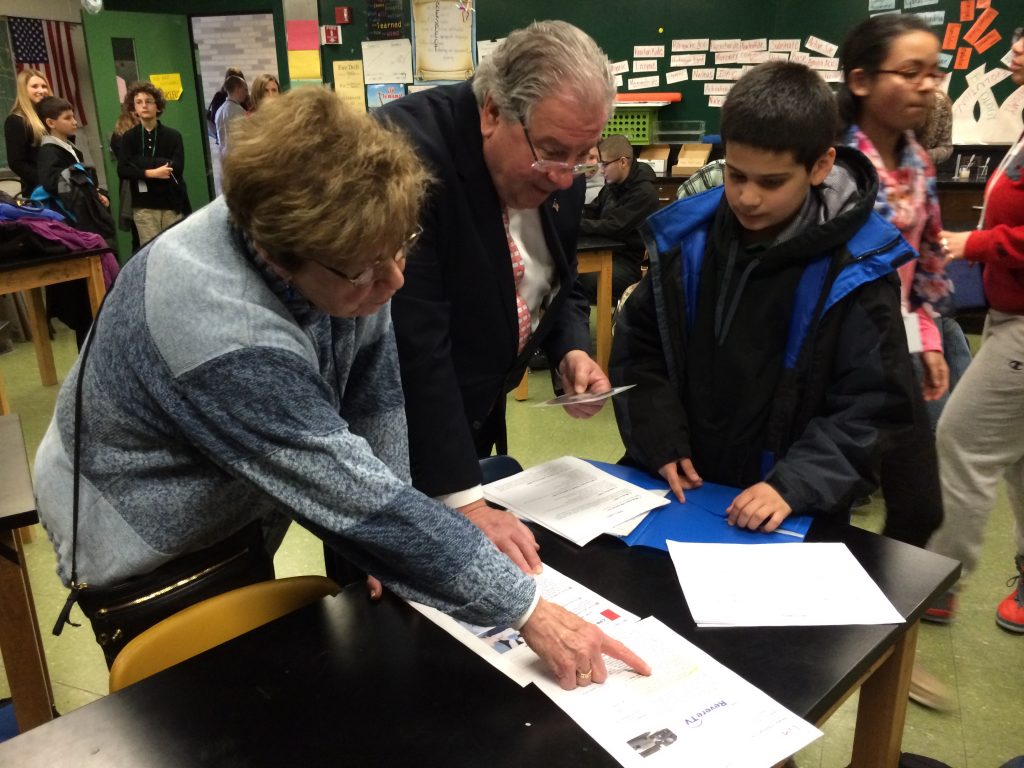 Speaker DeLeo, Revere school committee member and former Superintendent Carol Tye, and a student from Garfield Middle School in Revere during the MLSC equipment and supply grant announcement event at Revere High School.