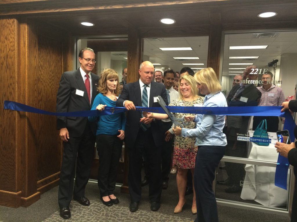 (From left to right) Jeff Dillon, Vice Consul-Trade & Investment Officer at the British Consulate-General Boston, Sharon Polleck, Research Scientist at Pfizer Pharmaceuticals, Mike Kennealy, Acting President and CEO of the MLSC, Laura Hamilton, Manager of Member Recruitment at MassBio and Louise Madden, Chief Operating Officer at Applied Photophysics participate in a ribbon cutting to celebrate the official opening of Applied Photophysics’ first North American facility in Beverly. 